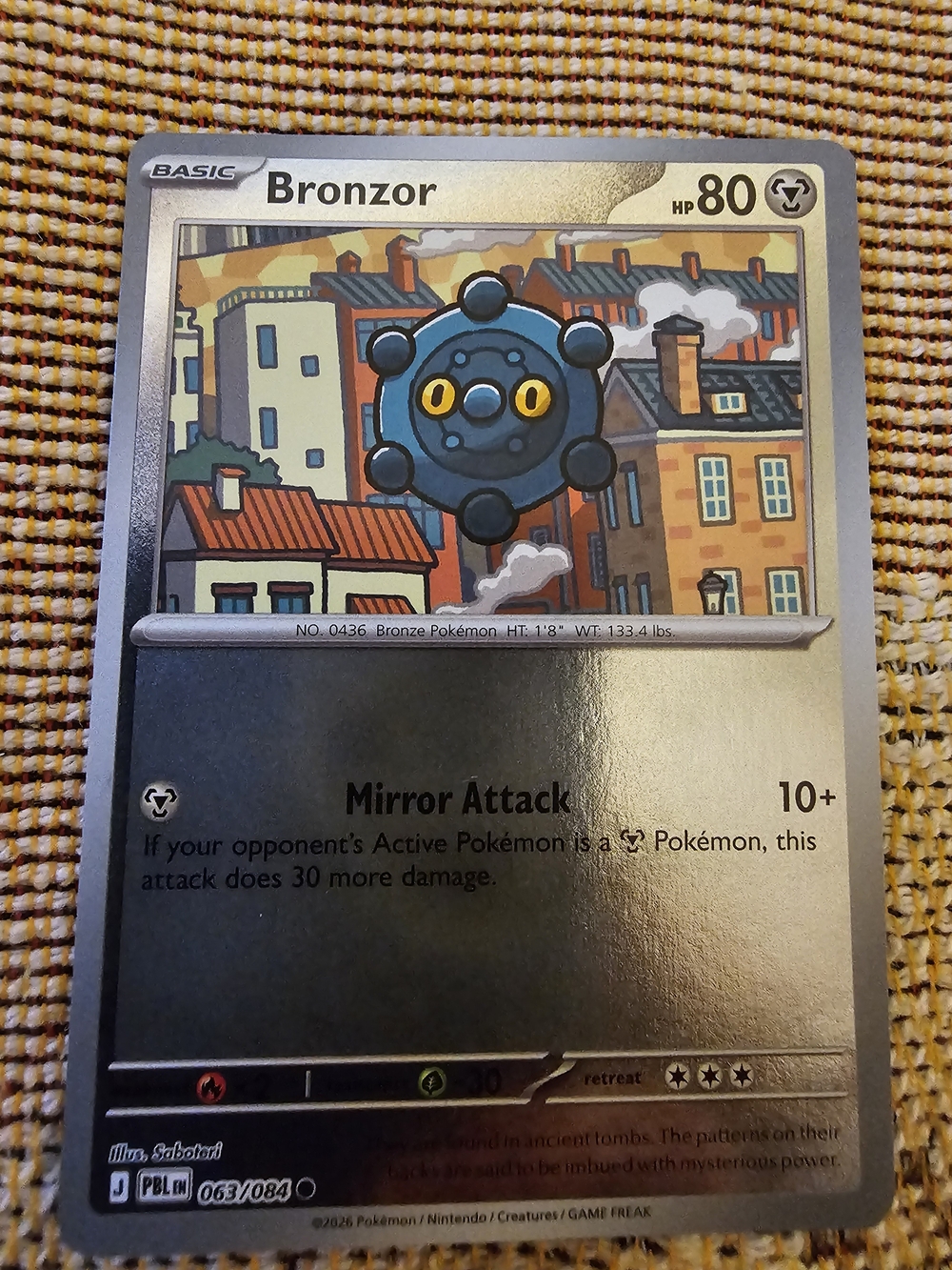 Bronzor common card (number 063/084) from the Pokémon TCG expansion set